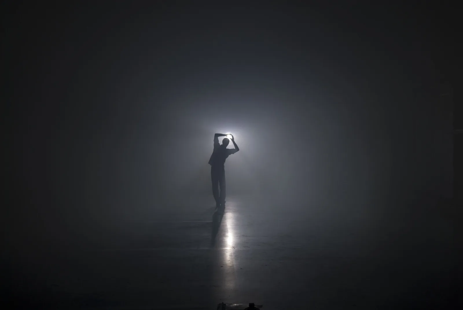 Kyrre Texnæs as a silhouette in light and haze